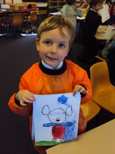 Angus painting a teddy bear